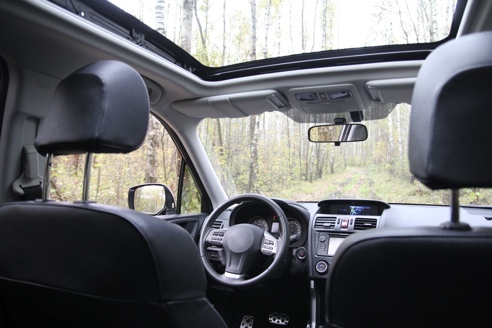 The,Control,Panel,,Steering,Wheel,,Windshield,And,Sunroof,In,The
