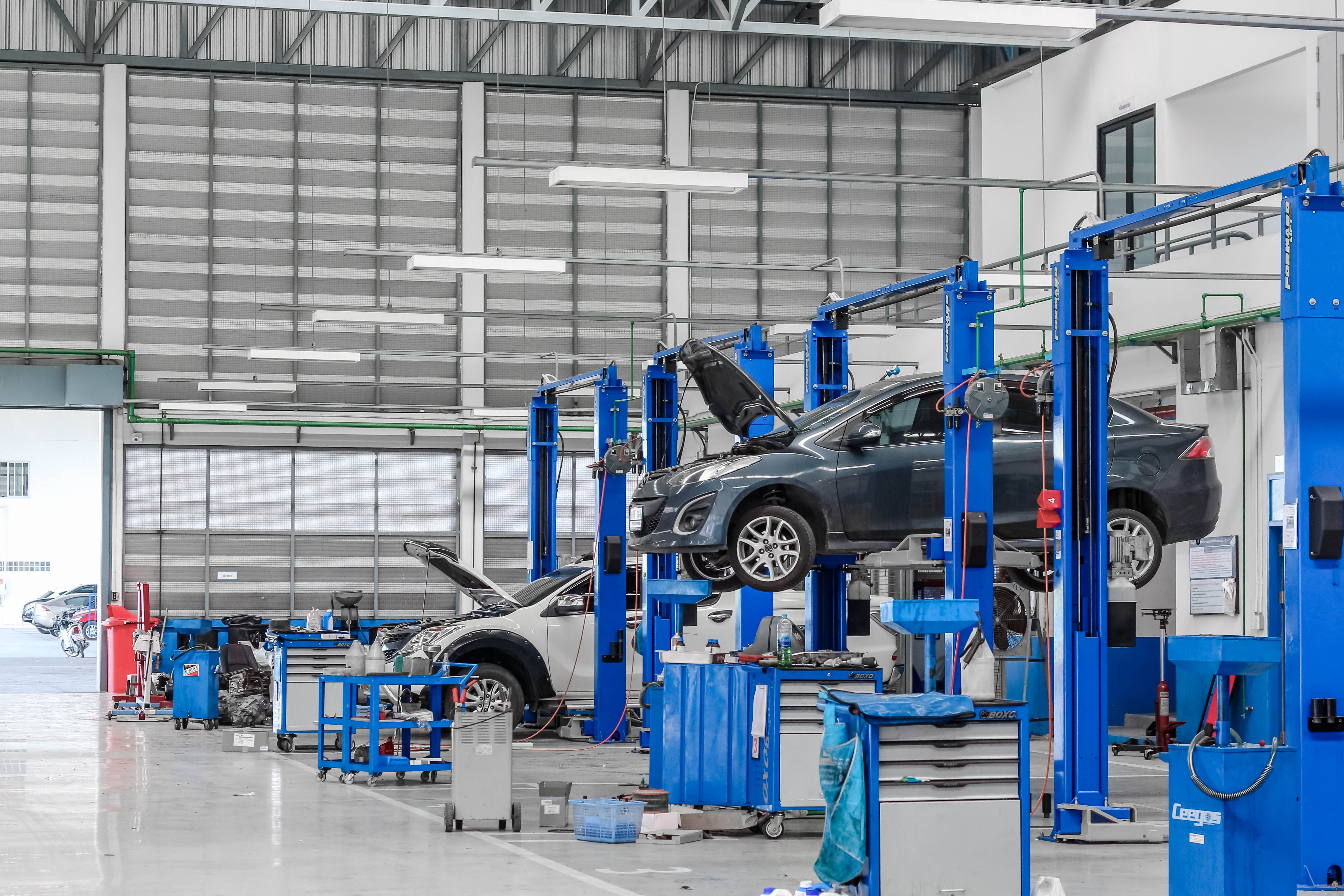Bangkok Thailand, December 10, 2016: Car in the lifting equipment in the garage being repair and fix at Bangkok,Thailand